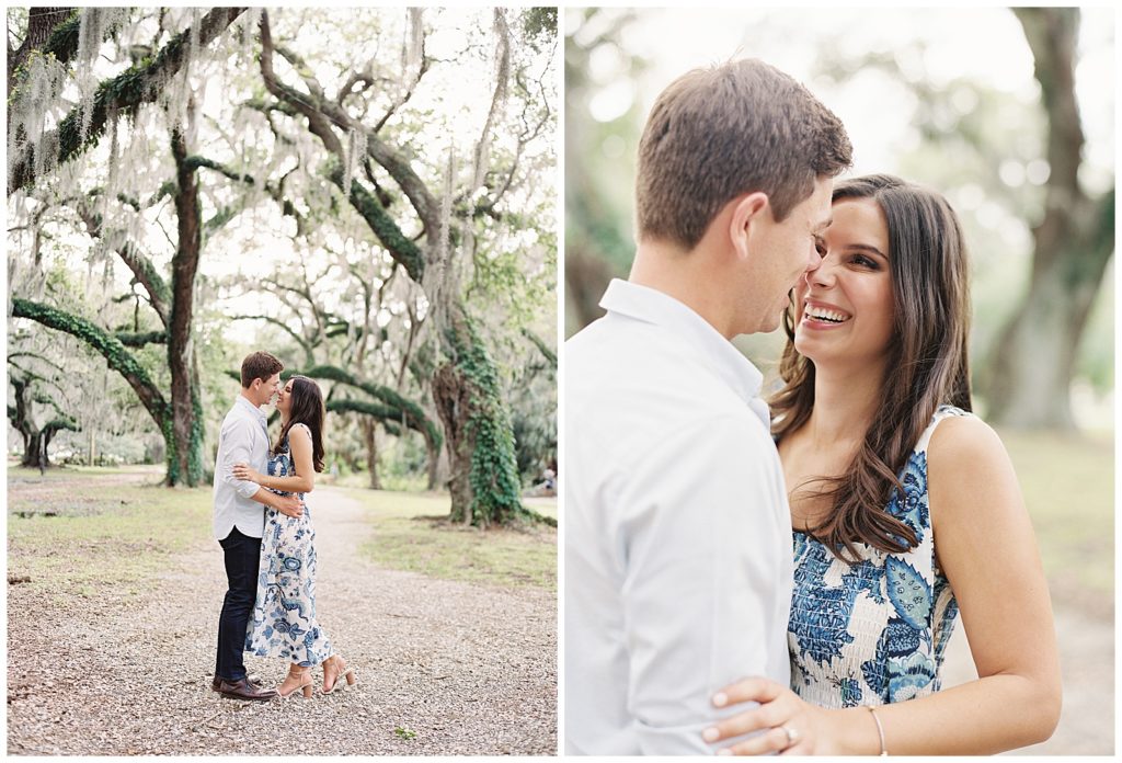 A couple wearing a white shirt and a blue dress take engagement pictures in City Park of New Orleans under the large live oak trees